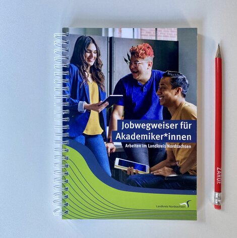 Titel eines Jobwegweisers mit Stift rechts daneben